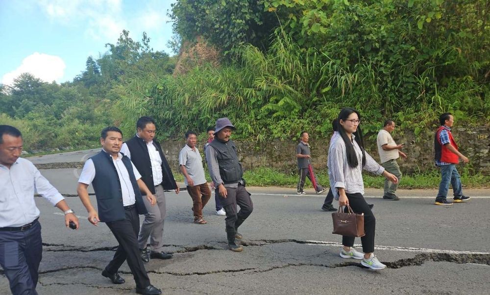 MLA and Advisor for Water Resources Tongpang Ozukum interacts with officials and local representatives during his visit to the landslide-affected areas under Chuchuyimlang on July 25.
